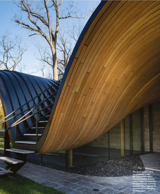  ??  ?? The guest house’s pièce de résistance: a follylike pool pavilion with a staircase leading up to its wavy rooftop. The structure boasts a dramatic overhang, achieved with an ingeniousl­y concealed 27.5-metre-long structural beam.