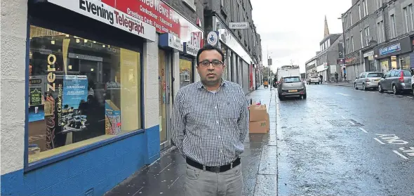  ??  ?? Sajid Ali, owner of Lochee News Plus, said there are too many off licence premises on Lochee High Street.