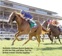  ??  ?? Wuheida (William Buick) holds on to win the Filly and Mare Turf for British trainer Charlie Appleby