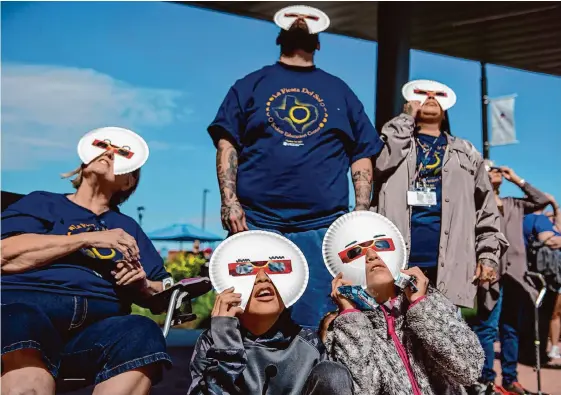  ?? Carlos Javier Sanchez/contributo­r ?? In October, the annular eclipse brought Emily White, from left back, William White-volk, Isabel Soria-white-volk, Nikolai Domingue, 11, and Erica Sonia, 9, to the San Antonio College campus. The total eclipse in April is expected to draw nearly 2 million to the area.