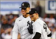 ?? Elsa / Getty Images ?? The Yankees’ Aaron Judge, left, and Anthony Rizzo react after the first out was recorded against the Houston Astros during the second inning in Game 3 of the American League Championsh­ip Series at Yankee Stadium on Oct. 22.