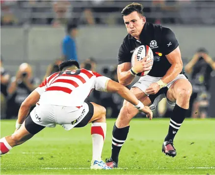  ??  ?? Matt Scott in action for Scotland against Japan.