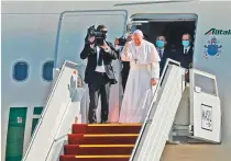  ?? AFP ?? Pope Francis bows in farewell to his hosts before boarding his Alitalia Airbus A330 aircraft as he departs from Baghdad yesterday.