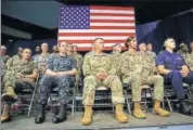  ?? REUTERS FILE ?? US military personnel listen to President Donald Trump