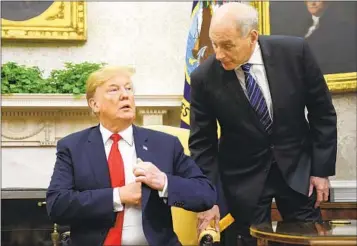  ?? PABLO MARTINEZ MONSIVAIS AP FILE ?? Then-White House chief of staff John Kelly leans in to talk with then-President Donald Trump in 2018.