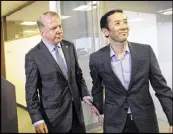  ?? AP ?? Seattle Mayor Ed Murray (left) walks away with his husband, Michael Shiosaki, after a news conference Friday.