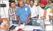  ??  ?? PN Raman (in blue) was the last man to send telegram from GPO on Sunday evening; (below) a child wearing a ‘goodbye-telegram’ cap.