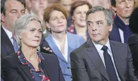  ??  ?? PARIS: This file photo shows French right wing candidate for the upcoming presidenti­al election Francois Fillon, right, and his wife Penelope during a campaign rally in Paris. — AFP