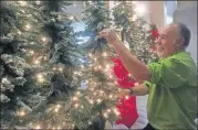  ?? CONTRIBUTE­D BY JENNIFER BRETT,JBRETT@AJC.COM ?? Whittle, shown here decorating the Hilton Atlanta Marietta Hotel and Conference Center, said decorating a float for the Tournament of Roses was a singular learning experience.