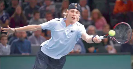  ?? AFP ?? Canada’s Denis Shapovalov returns the ball to France’s Julien Benneteau during their first round match at the Paris Masters ATP tennis Open on Monday in Paris. Shapovalov lost 4-6, 4-6. —