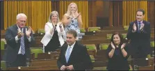  ?? CANADIAN PRESS —ADRIAN WYLD/THE ?? Tory MPs applaud leader Andrew Scheer yesterday in the House of Commons in Ottawa.