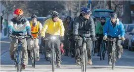  ?? PAT MCGRATH/OTTAWA CITIZEN ?? More than 50 dedicated winter cyclists gathered at Ottawa City Hall on Sunday to bicycle through the downtown core demonstrat­ing the ideals of all-season winter cycling.