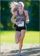  ?? SARAH GORDON/THE DAY ?? Montville’s Mady Whittaker holds a strong lead towards the end of the ECC girls’ cross country championsh­ip meet on Thursday at the Norwich Golf Course.