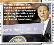  ??  ?? Workers document Gov. Cuomo’s announceme­nt Thursday that conversion of old Farley Post Office into a sprawling station for LIRR and Amtrak is underway.