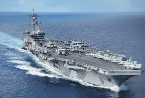  ?? MCSPC 2ND CLASS Z.A. LANDERS / AFP / US NAVY ?? The Navy aircraft carrier USS Carl Vinson is within striking range of North Korea “if the president were to call on it,” according to Adm. Harry Harris Jr.