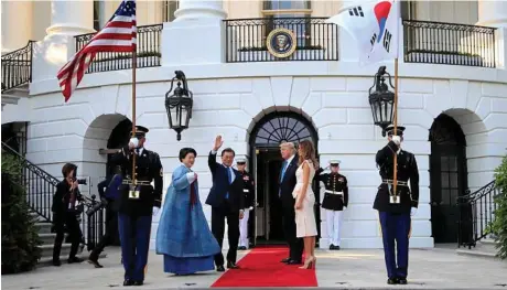  ?? PHOTO: MANUEL BALCE CENETA/AP ?? UNITED APPROACH: US President Donald Trump and First Lady Melania Trump welcome South Korean President Moon Jae-in and his wife Kim Jung-sook at the South Portico of the White House.