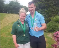  ??  ?? John McGrath (Deerpark, Mens) and Lisa O’Connor (Tralee, Ladies Nett) with their prizes for reaching the semi-finals of their events at the National Pitch & Putt Matchplay Championsh­ips in Tullamore, Co Offaly on Monday.