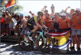  ?? PETER DEJONG — THE ASSOCIATED PRESS ?? Netherland­s’ Steven Kruijswijk passes cheering Dutch fans during the twelfth stage of the Tour de France cycling race over 175.5 kilometers (109 miles) with start in Bourg-SaintMauri­ce Les Arcs and Alpe d’Huez, France, Thursday.