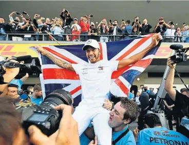  ?? /Getty Images ?? Great Briton: Lewis Hamilton joins an elite band of drivers after his fourth place in the Mexican Grand Prix on Sunday.