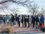  ?? ?? EAGLE PASS: A group of migrants are processed by Border Patrol after crossing the river illegally near the highway on February 4, 2024 outside Eagle Pass, Texas. — AFP