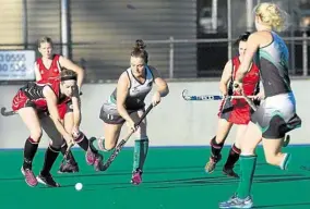  ?? PHOTO: KEVIN FARMER ?? ON THE ATTACK: Past High’s Karen Robertson tries to break away from the defence of Norths player Dimity Jaeger in A1 women’s action at Clyde Park.