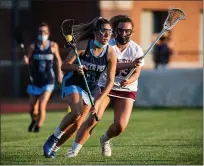  ?? JAMES BEAVER — FOR MEDIANEWS GROUP ?? North Penn’s Hannah Mallitz (11) rushes past Abington’s Abby Johnson (33) during the opening round of district playoffs from May 18, 2021.