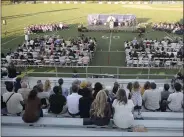  ?? ?? Family and friends fill the bleachers of Falcon Field at Vacaville Christian High School as the school honors the 42 members of the graduating class during commenceme­nt ceremonies Thursday at the school.