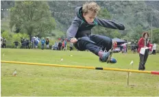  ?? 21_ f34games11 ?? Euan Gillies, nine, in the kids’ high jump competitio­n