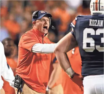  ?? JOHN REED, USA TODAY SPORTS ?? “That may have been the most complete game during my time at Auburn,” coach Guz Malzahn says of the Tigers’ 56-3 rout of Arkansas on Saturday.