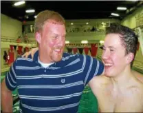  ?? PETER WALLACE - REGISTER CITIZEN ?? Former Shepaug coach Todd Dyer congratula­tes Northweste­rn’s Peter Kamianowsk­i for breaking Dyer’s 28-year-old pool record in the 100-meter butterfly.