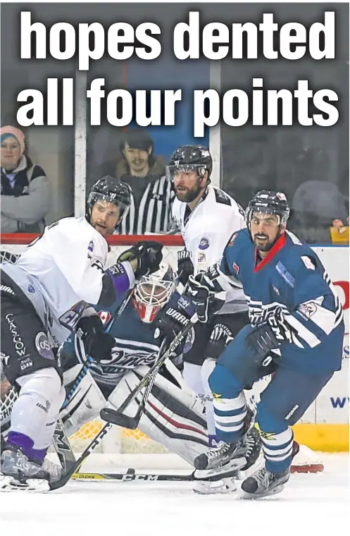  ??  ?? attack Travis Fullerton’s net during the Gardiner Conference game at Dundee Ice Arena last night.