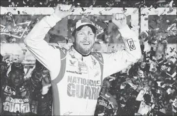  ?? TOMPENNING­TON/ GETTY IMAGES ?? Dale Earnhardt Jr. celebrates his second Daytona 500 win in a race that was delayed by rain for over six hours.