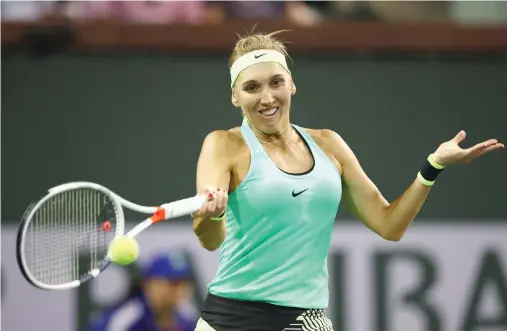  ??  ?? Elena Vesnina plays a forehand against Angelique Kerber in their fourth-round match in Indian Wells, California, on Tuesday night. (AFP)