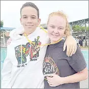  ?? (Courtesy pics) ?? SwimLab Swimming Club’s record breakers Luca Fraser (L) and Hayley Hoy (R) in a celebrator­y mood on Saturday during the second Eswatini Swimming Associatio­n Age Group Gala held at Enjabulwen­i School.