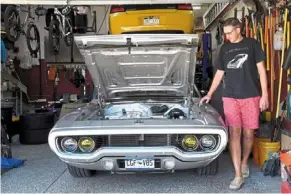  ?? — AP ?? erickson with his electrifie­d 1972 Plymouth satellite at his home in Colorado, the united states. He is part of a small but growing group of people across the country converting vintage cars and trucks into greener, and often much faster, electric vehicles.