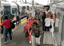  ?? TODD NIALL/ STUFF ?? Passengers arrive at Auckland’s Strand train station on the Te Huia service from Hamilton during the April school holidays and the half-price fare initiative.