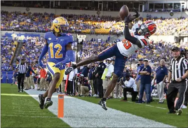  ?? AP PHOTO/BARRY REEGER ?? Syracuse wide receiver D’Marcus Adams (85) fails to catch a pass in front of Pittsburgh defensive back M.J. Devonshire (12) during the first half of an NCAA college football game, Saturday, Nov. 5, 2022, in Pittsburgh.