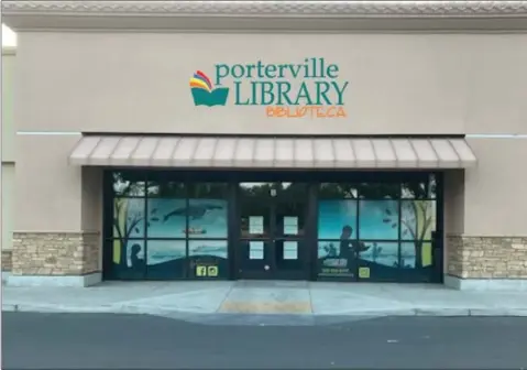  ?? PHOTO COURTESY OF CITY OF PORTERVILL­E ?? The sign that will be displayed at the temporary library adjacent to Grocery Outlet when it opens.