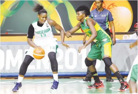  ??  ?? Elo Edema Edeferioka of D’Tigress (L) takes on a Senegalese opponent during their group match at the 2015 FIBA Afrobasket in Cameroon