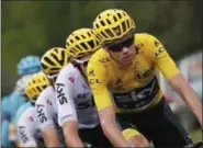  ?? CHRISTOPHE ENA — THE ASSOCIATED PRESS ?? Britain’s Chris Froome, wearing the overall leader’s yellow jersey, rides in the pack as it chases after a breakaway group of four riders during the seventh stage of the Tour de France cycling race over 213.5 kilometers (132.7 miles) with start in...