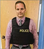  ?? CONTRIBUTE­D ?? Jupiter police Sgt. Steven Drake models one of the department’s bulletproo­f vests, purchased last year.