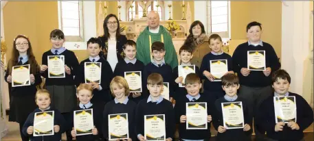  ??  ?? Newbawn 5th and 6th class pupils with teacher Michelle O’Grady, Fr Jimmy Moynihan and Tessie Dunphy secretary PTAA.