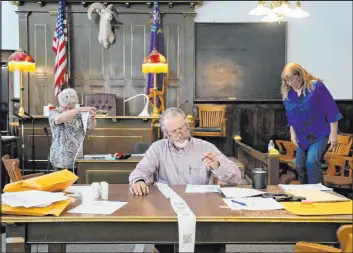  ?? John Locher The Associated Press ?? Esmeralda County Commission­er Ralph Keyes recounts ballots by hand in June. The Nevada secretary of state’s office approved hand-counting regulation­s on Friday.