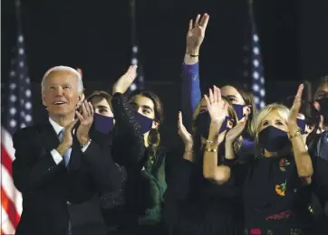  ?? WIN MCNAMEE — GETTY IMAGES ?? President-elect Joe Biden and his family watch fireworks after addressing the nation from the Chase Center Saturday in Wilmington, Del. After four days of counting ballots in key battlegrou­nd states, Biden was called the election winner.