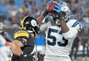  ?? Matt Freed/Post-Gazette ?? Panthers defensive end Brian Burns intercepts a ball intended for Steelers fullback Derek Watt in the first quarter.