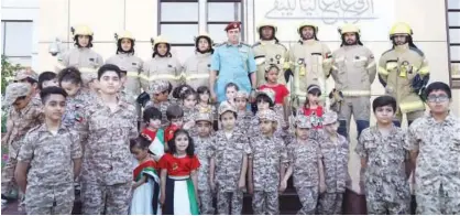  ?? WAM ?? A number of kindergart­en and school students marked Martyrs Day at the Ajman Civil Defence premises.