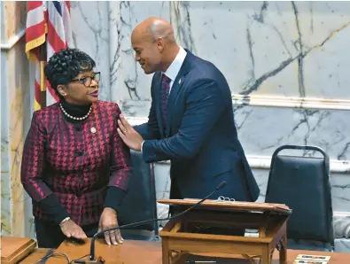  ?? KIM HAIRSTON/BALTIMORE SUN ?? ABOVE: Speaker of the Maryland House of Delegates Adrienne Jones and Gov. Wes Moore talk after his first State of the State address in the House chamber in the State House.