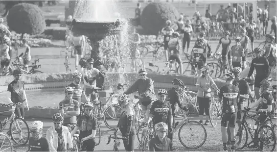  ??  ?? Tour de Victoria cyclists gather around a fountain at the B.C. legislatur­e on Aug. 18. Top: part of the sea of faces at the event made up of seven rides.