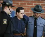  ?? BUTCH COMEGYS ?? In this file photo, Eric Frein is led away by Pennsylvan­ia State Police Troopers at the Pike County Courthouse after his preliminar­y hearing in Milford, Pa.