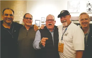  ?? JASON RILEY/HANDOUT ?? David Sidoo, left, seen here in October with his former UBC Thunderbir­d football teammates at a Vancouver pizza parlour, is “a good-hearted person,” according to Jason Riley, seen above in black cap.